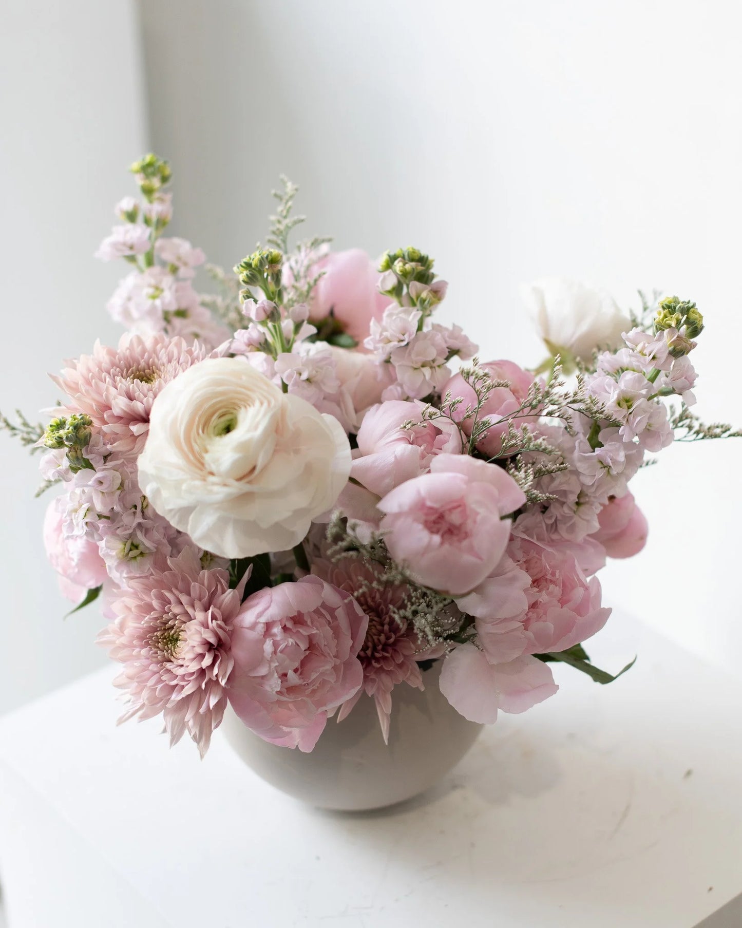 Elegant pink and white floral arrangement in a vase by Annam Studio, Toronto florist