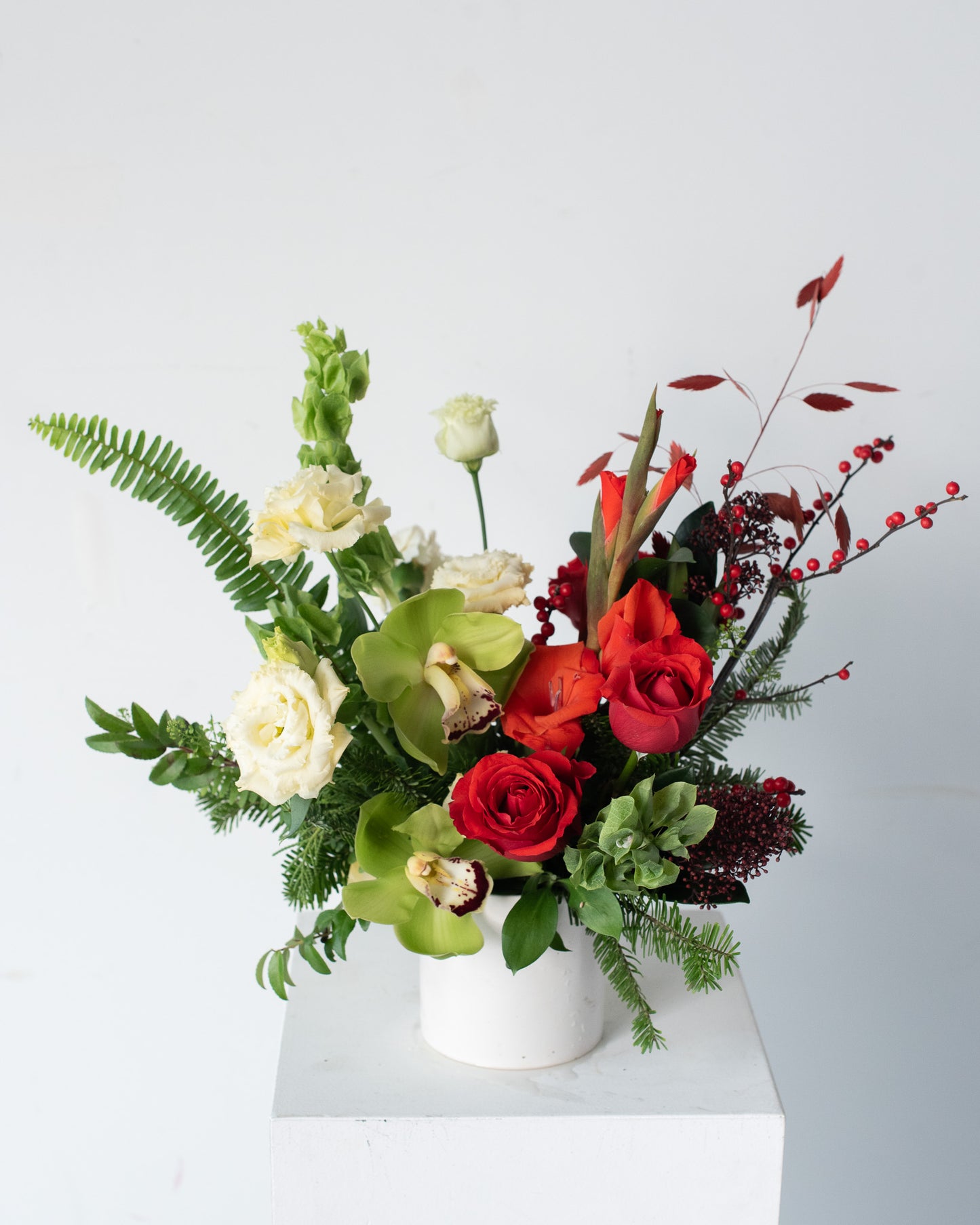 Floral vase arrangement with red and white flowers in a white vase for delivery or pickup in Toronto.