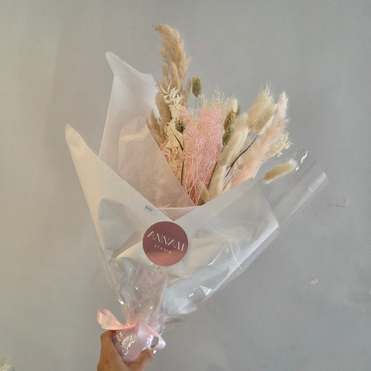 Bouquet of dried flowers wrapped in clear plastic for delivery or pickup in Toronto.