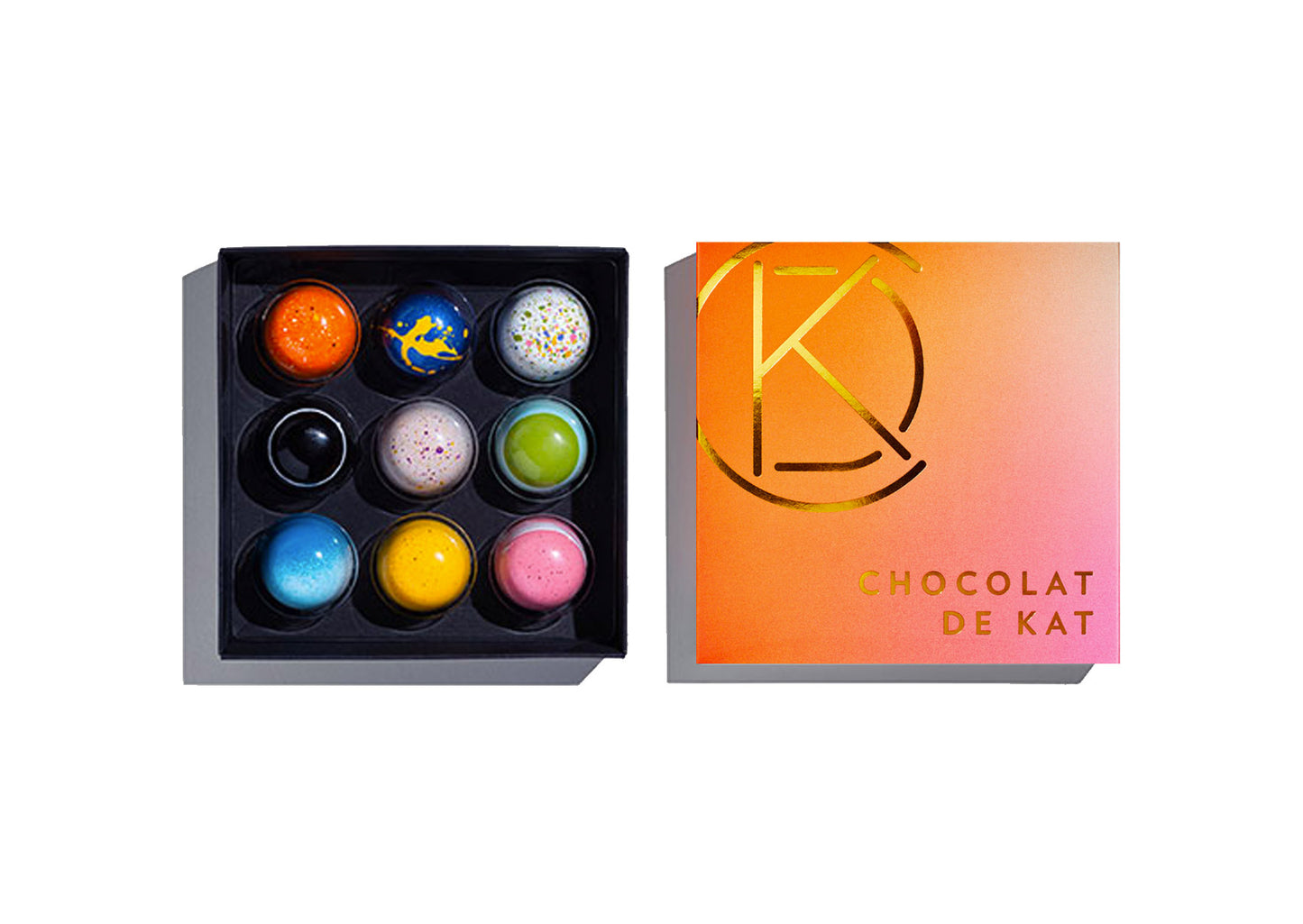 Box of colorful chocolate balls with a branded box for delivery or pickup in Toronto.