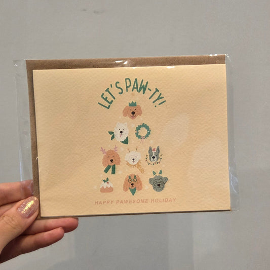 Let's Paw-Ty holiday card with dog illustrations and an envelope for delivery or pickup in Toronto.