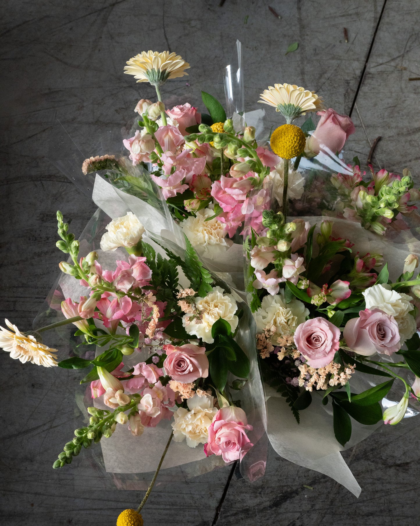Bouquets of flowers with pink, white, and yellow flowers for delivery or pickup in Toronto.