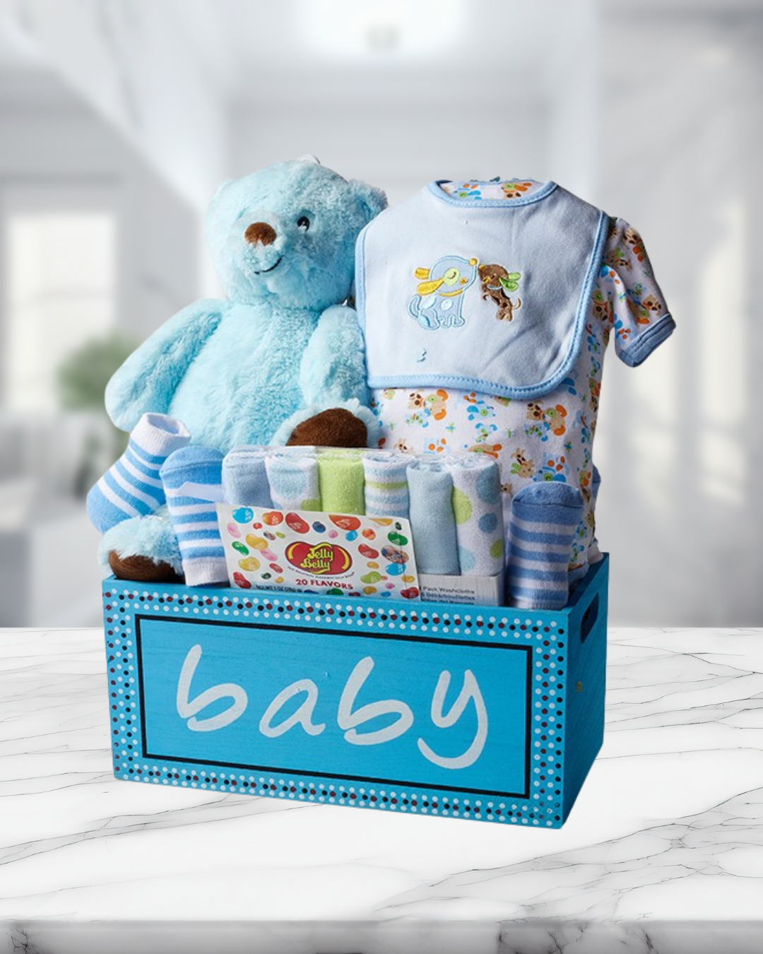 Baby gift basket with teddy bear, bib, and other items for delivery or pickup in Toronto.