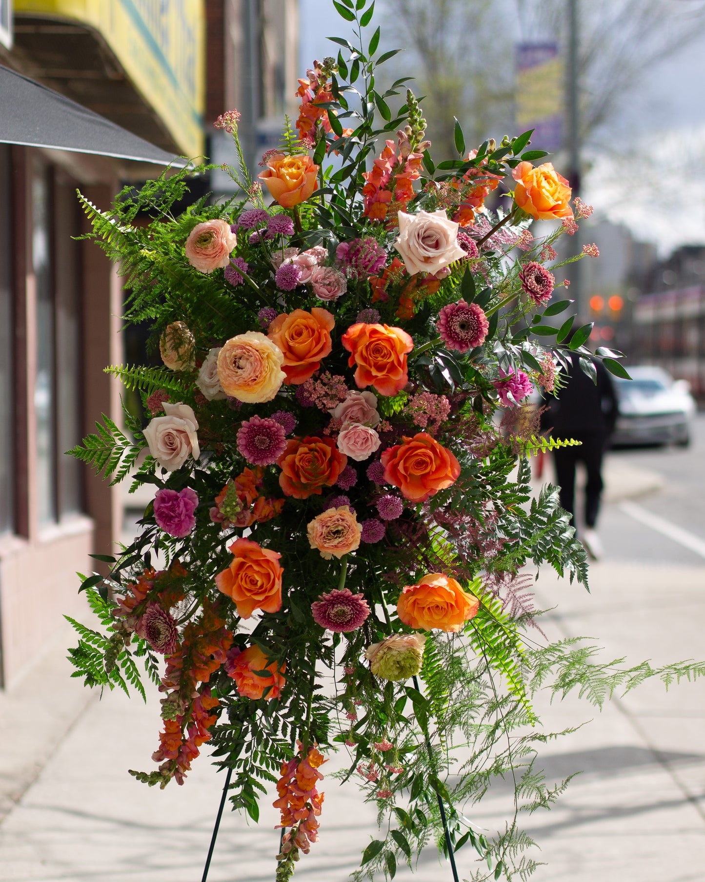 Colorful standing spray flower arrangement for delivery or pickup in Toronto.