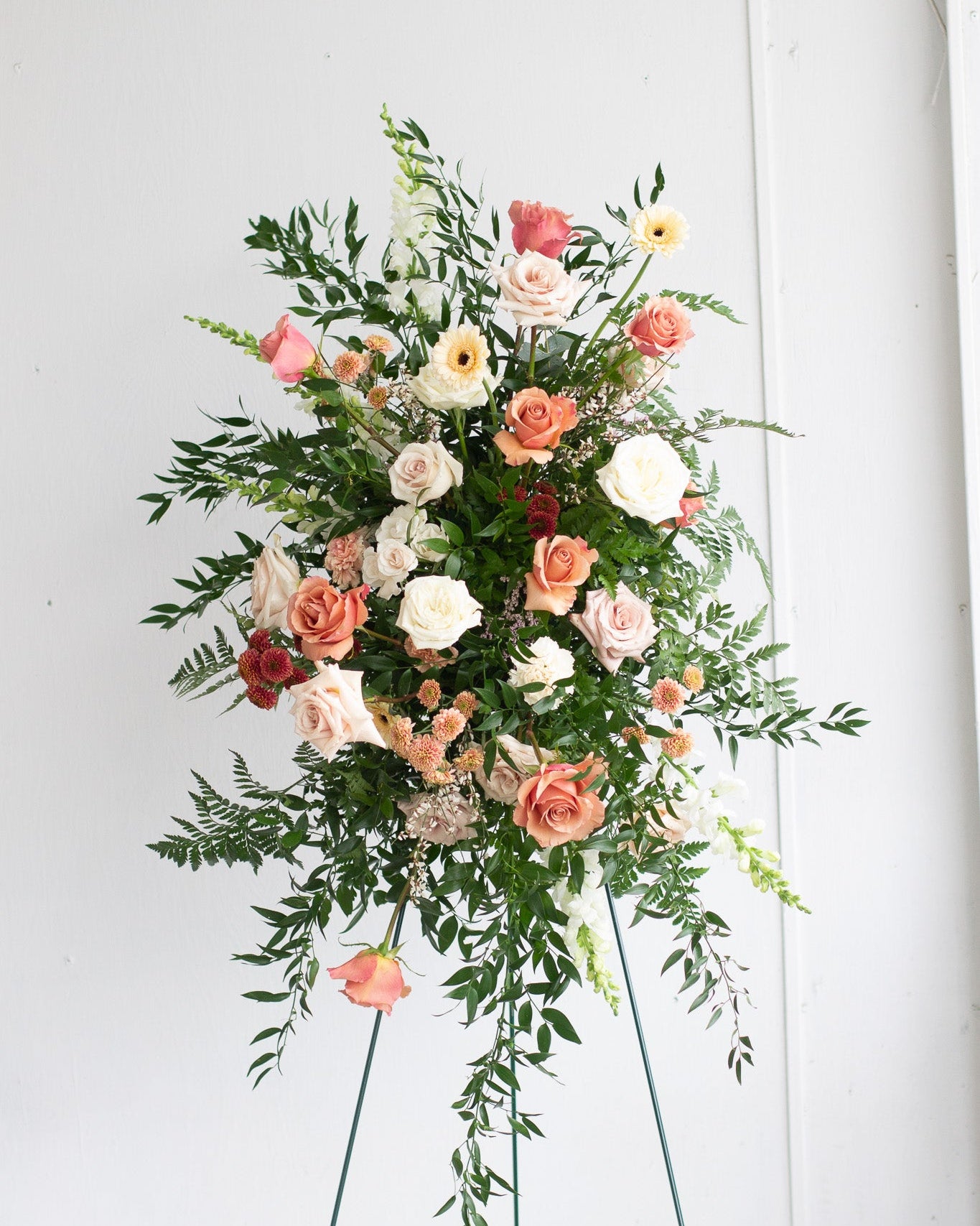 Custom standing spray arrangement with pink, white, and green flowers for delivery or pickup in Toronto.