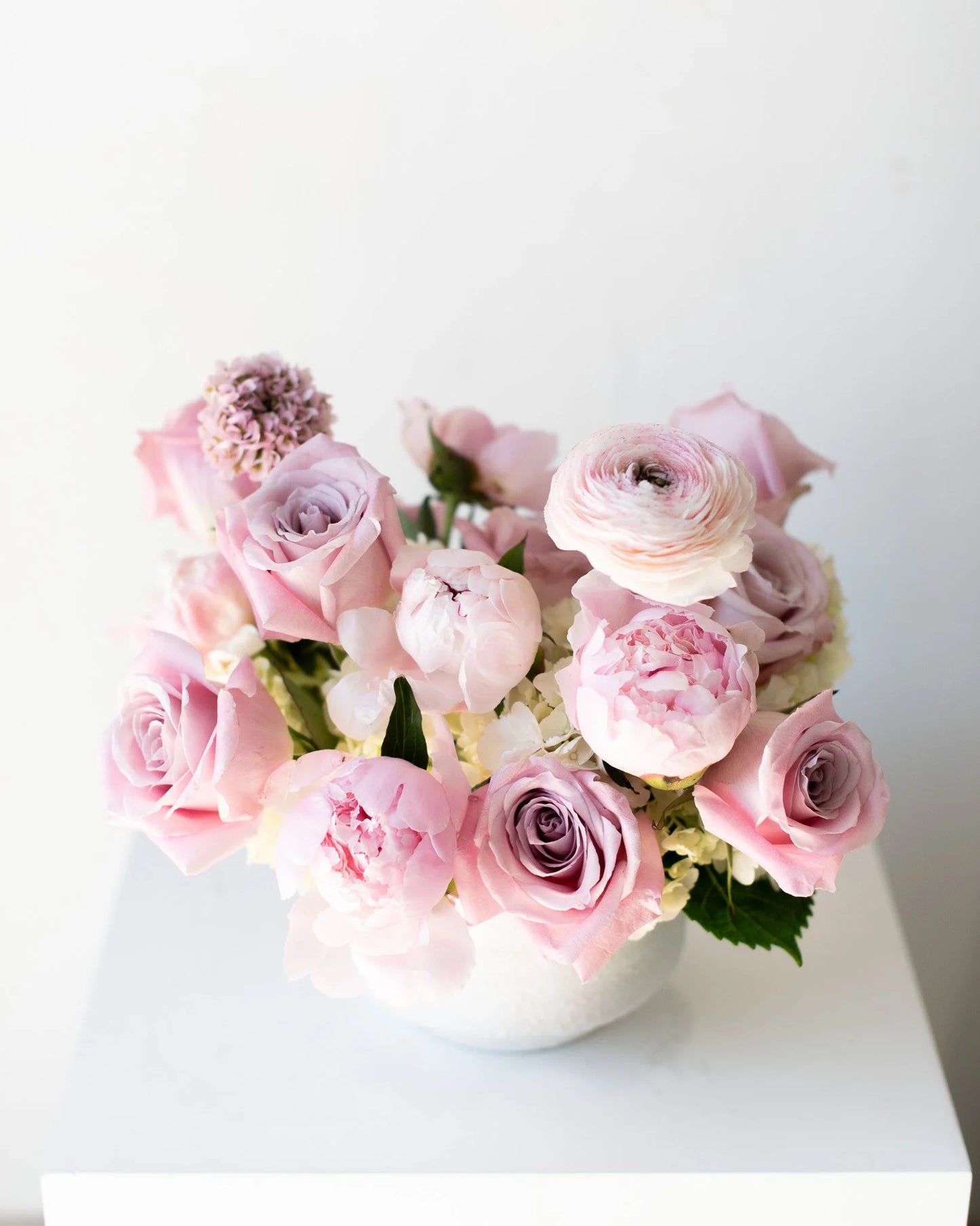 Modern pink rose and peony floral arrangement by Annam Studio Toronto on white table