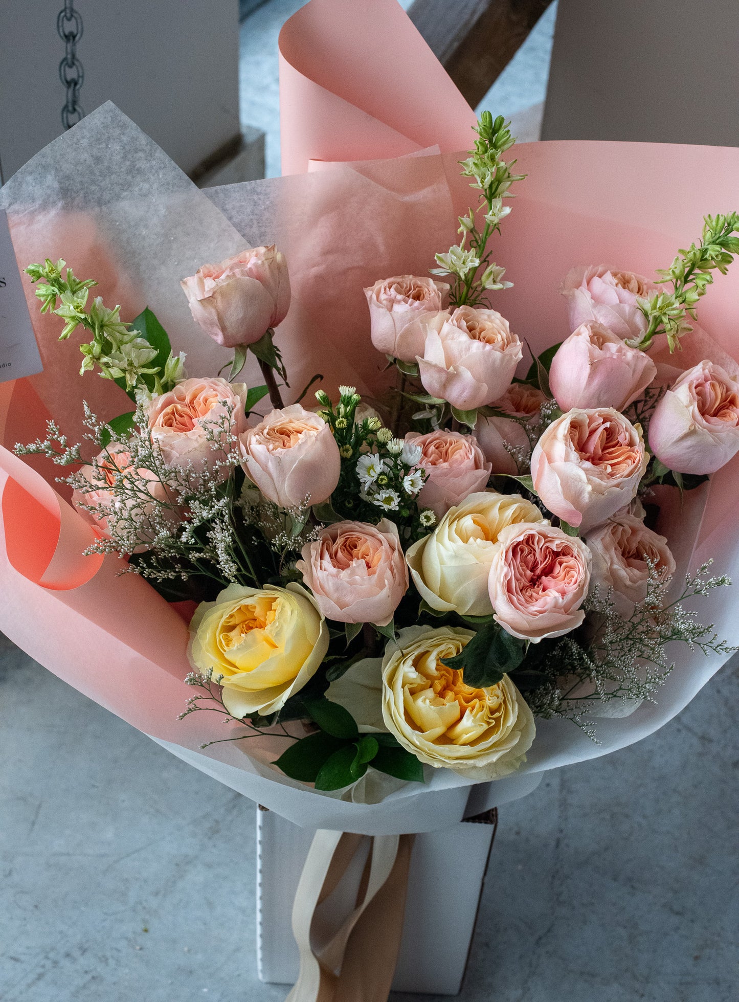 Bouquet of flowers with pink and yellow roses for delivery or pickup in Toronto.