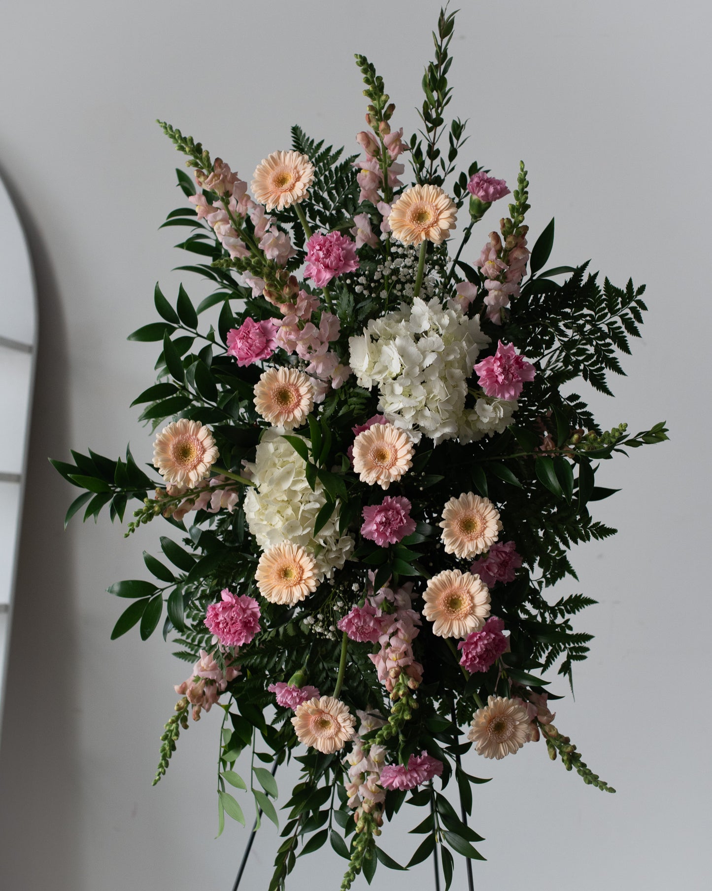 Carnations, snapdragons and daisy arrangement for celebrations or funerals for delivery or pickup in Toronto.