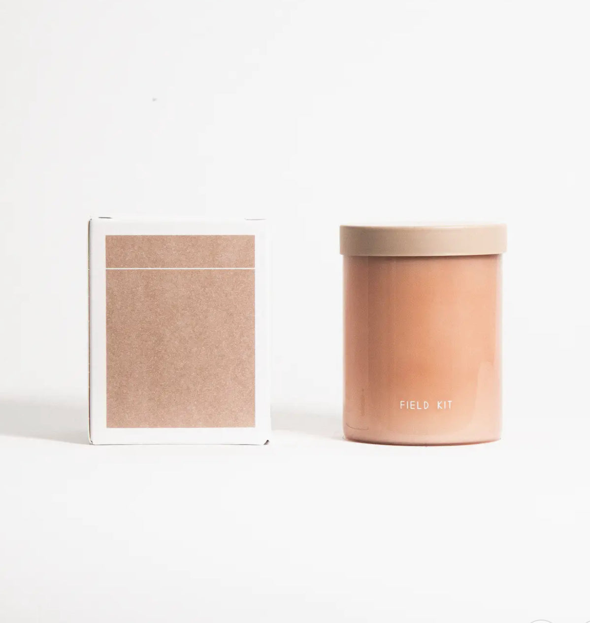 Minimalist tan candle in glass jar labeled 'Field Kit' with matching box, Annam Studio Toronto